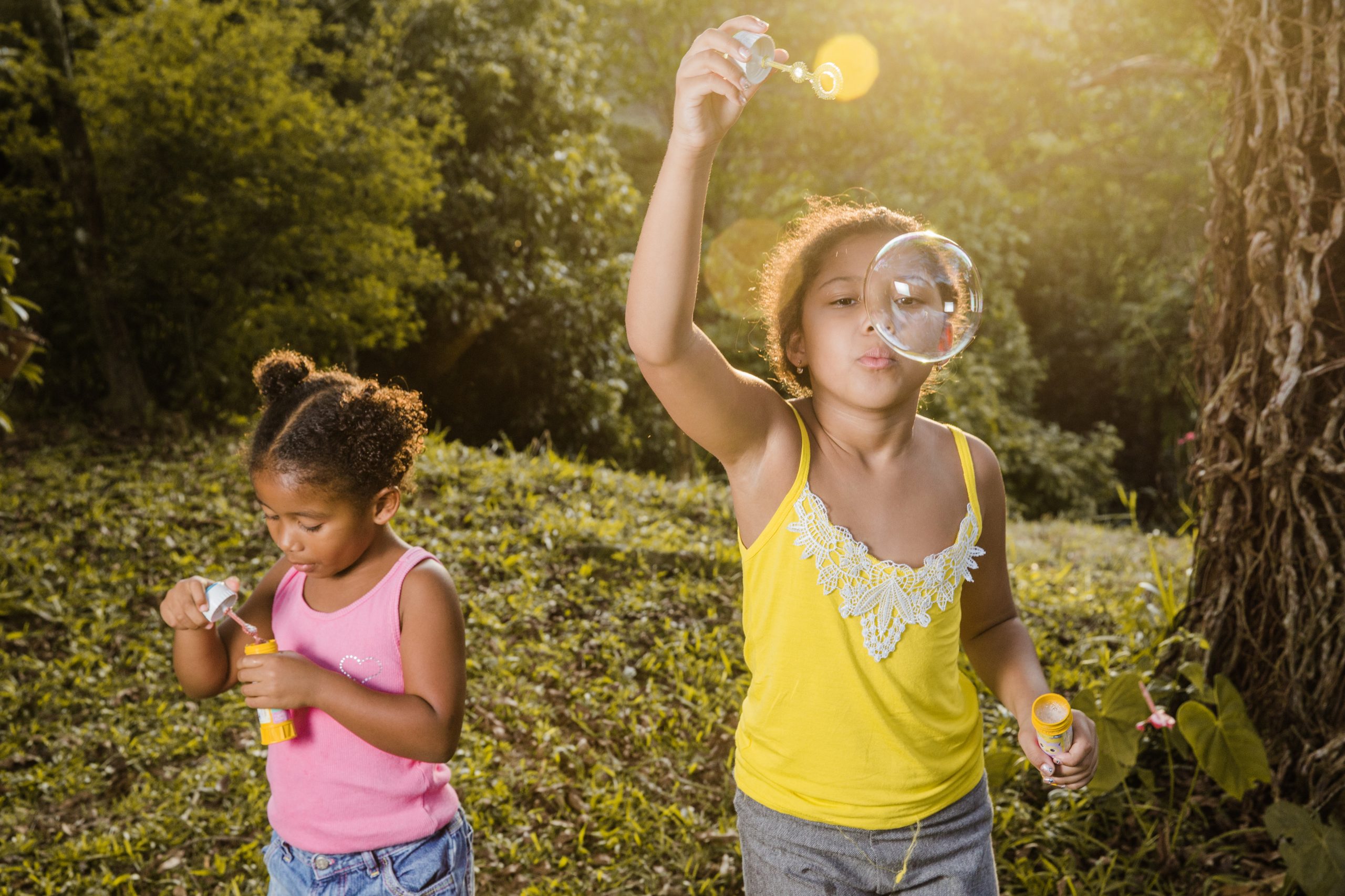 two-girls-making-soap-bubbles